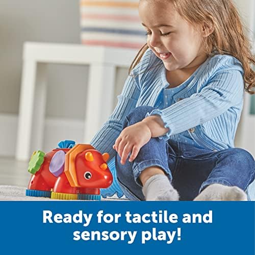 Montessori inspired dinosaur fidget companion highlighting the integrated spinning wheels