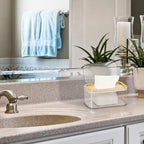 Translucent baby wipes dispenser case on a vanity table