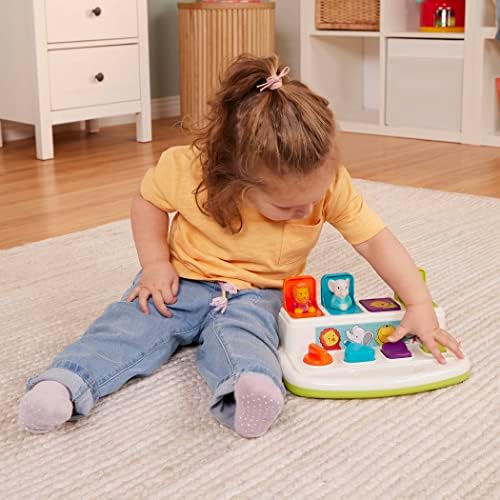 Close up view of the colorful interactive buttons including the dial and slide switch