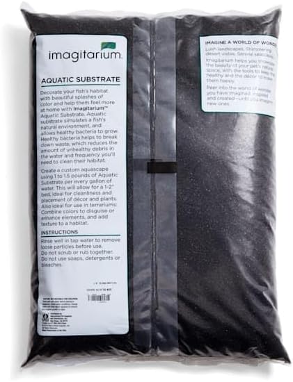 Black aquarium sand inside a fish tank for aquascaping