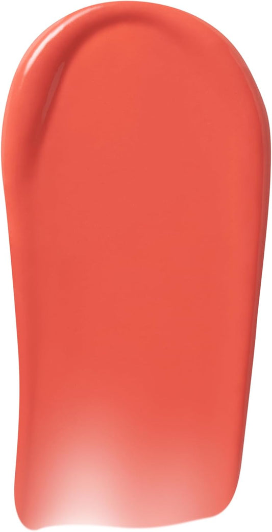 Close up of the rounded grooved applicator tip coated in high pigment orange pink liquid blush.