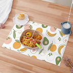 Demonstration of a spill being absorbed cleanly by the non woven fabric layer of the disposable placemat