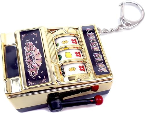 Close up view of the manual crank handle and coin slot on the MAGIKON miniature novelty bank.