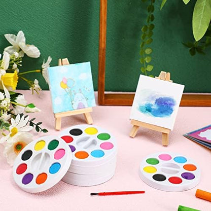 Close up view of the eight color round watercolor palette tray and refillable water storage brush
