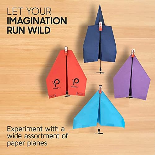 PowerUp 2.0 electric paper plane converter module in action during an outdoor flight launch.