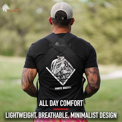 Father wearing military style tactical baby carrier outdoors
