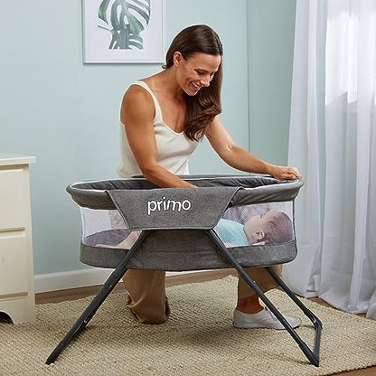 Side angle of the bedside sleeper showcasing the breathable mesh walls for maximum airflow.