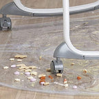 Folded clear plastic baby eating mat showing its compact and travel friendly design