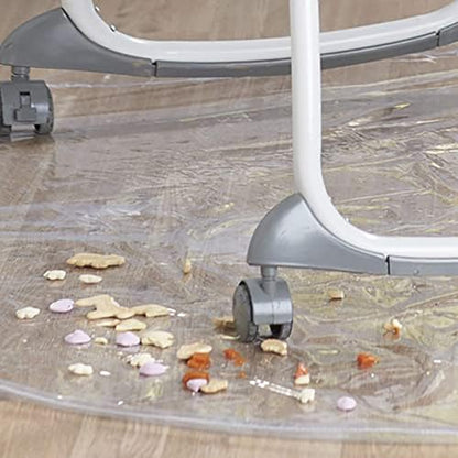 Folded clear plastic baby eating mat showing its compact and travel friendly design