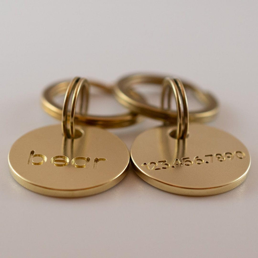 Uncoated solid brass pet identification tag with a beautiful natural patina