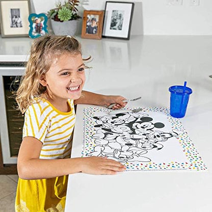 Toddler using the J.L. Childress stick on disposable table mat at a restaurant table.