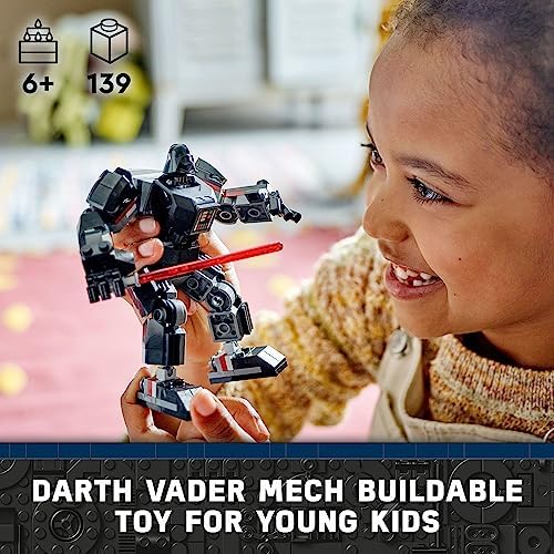 LEGO Darth Vader minifigure with red lightsaber standing outside the open cockpit