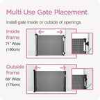 Perma Child Safety hardware mount retractable gate installed at the bottom of stairs.