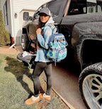 Wrangler travel daypack side profile highlighting insulated bottle pockets