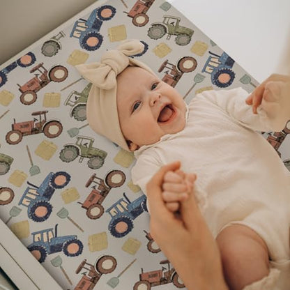 Elastic band detail for secure fit on changing pad