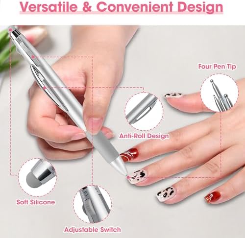 Hand holding silver ballpoint design nail dotting pen