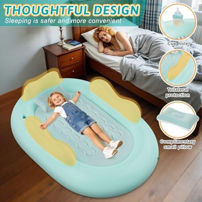 Green inflatable travel crib transition mattress for camping and home use.