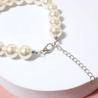 RayMinsino snow white pet pearl collar close-up detail of the resin beads.