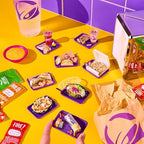 Completed miniature Taco Bell food replicas showcased inside the open clear sphere display pod.