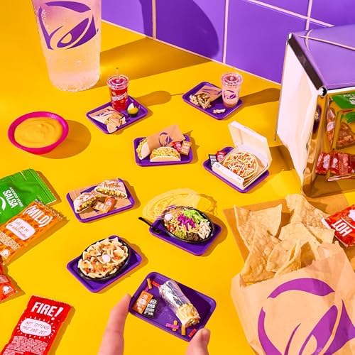 Completed miniature Taco Bell food replicas showcased inside the open clear sphere display pod.