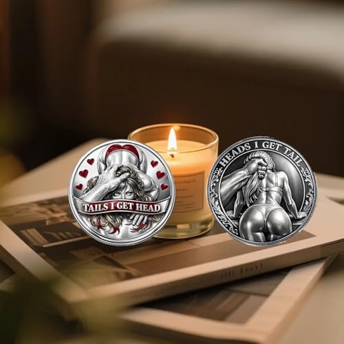 AuoiliouA double sided romantic decision making token held between two fingers for scale