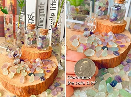 Top down view of Qinjiejie fluorite gemstone chips spread on a surface.