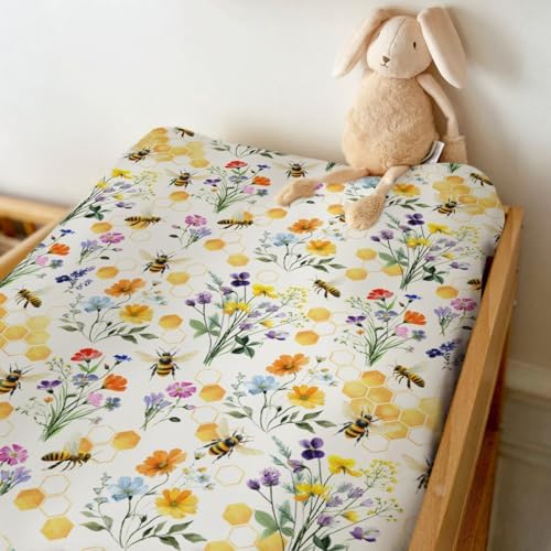 Side view of fitted floral baby changing table mat