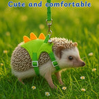 Green dinosaur style hamster clothes showing the adjustable underbelly straps