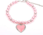 XKSRWE pet pearl necklace collar front view featuring pink rhinestone heart pendant.