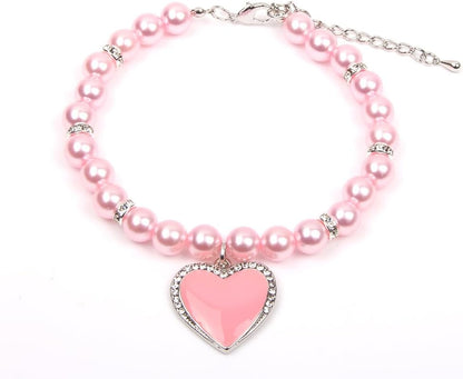 XKSRWE pet pearl necklace collar front view featuring pink rhinestone heart pendant.