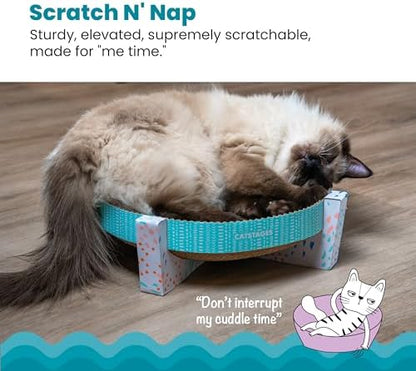 An adult cat resting comfortably inside the elevated Catstages hammock lounger after a playful scratching session.