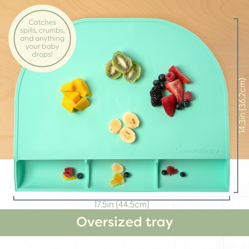 Toddler using the non slip silicone travel placemat during baby led weaning.