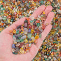 Ezeelai multicolor agate gravel rocks in a clear glass container.
