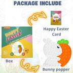 White bunny and orange carrot silicone pop fidget toy separated on flat surface