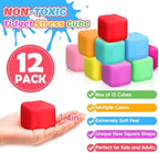 A hand squeezing a colorful dough stress ball to demonstrate its soft slow-rise texture.