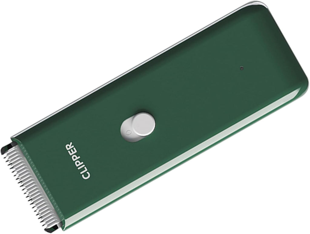 Green waterproof cordless pet hair clippers showing USB charging indicator light