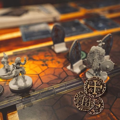 Leib Games bronze metal tokens being used as currency for a fantasy board game