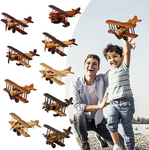Handmade wooden biplane toy close up highlighting rustic brown finish and rigging.