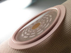 Hollister two-piece ostomy system Red code floating flange detail for skin protection.