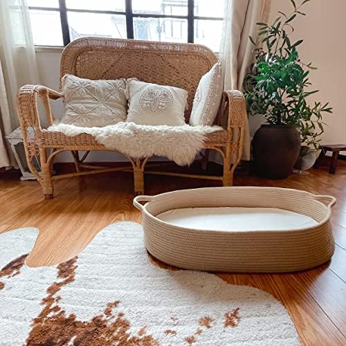 Folded Meloom baby basket being stored inside eco friendly storage bag