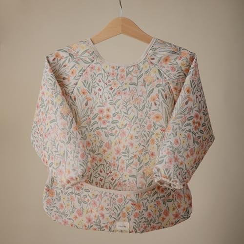 Water resistant toddler smock with wide food catcher pocket and elastic sleeves