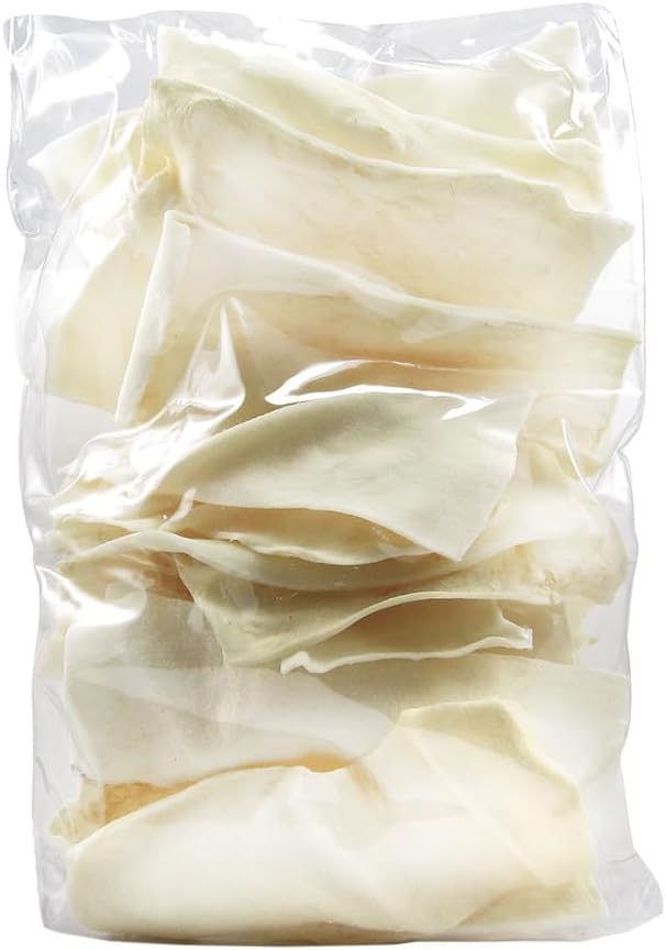 Good 'n' Fun rawhide chips spread out showing authentic texture and shape.