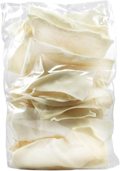 Good 'n' Fun rawhide chips spread out showing authentic texture and shape.