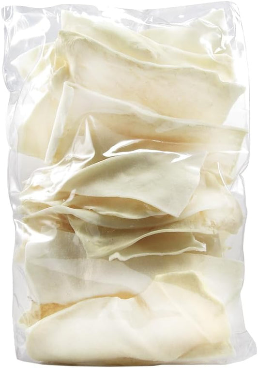 Good 'n' Fun rawhide chips spread out showing authentic texture and shape.