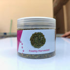 Loose leaf natural catnip blend scattered next to packaging