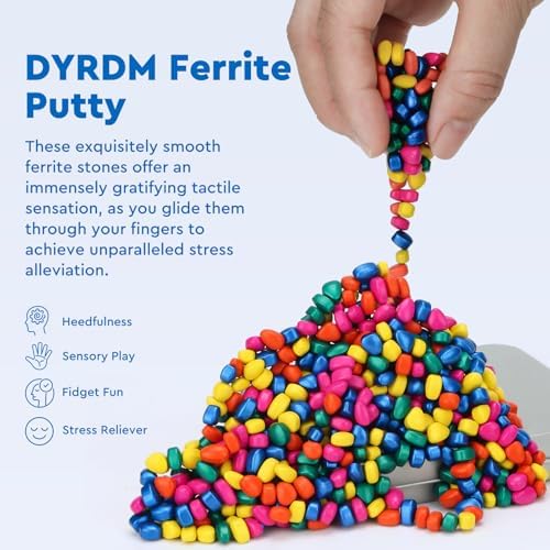 Close up of Dyrdm ferrite sensory stones in metal storage tin