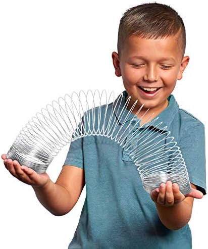 Oversized metal slink toy stretching out horizontally to show coil tension