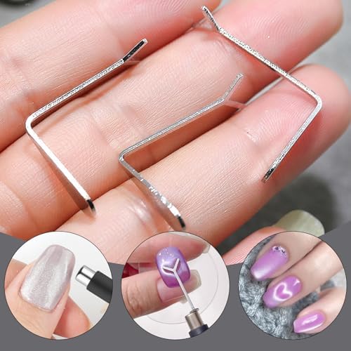 Hand holding magnetic wand for cat eye nail art application