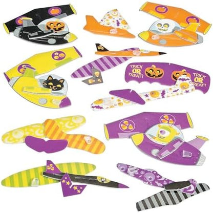 Assorted colorful spooky pumpkin and monster mini airplane gliders assembled for flight