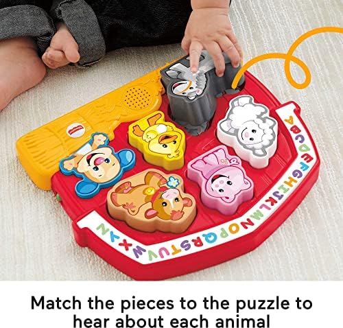 Close-up view of the durable plastic cow and horse puzzle pieces designed for small toddler hands.